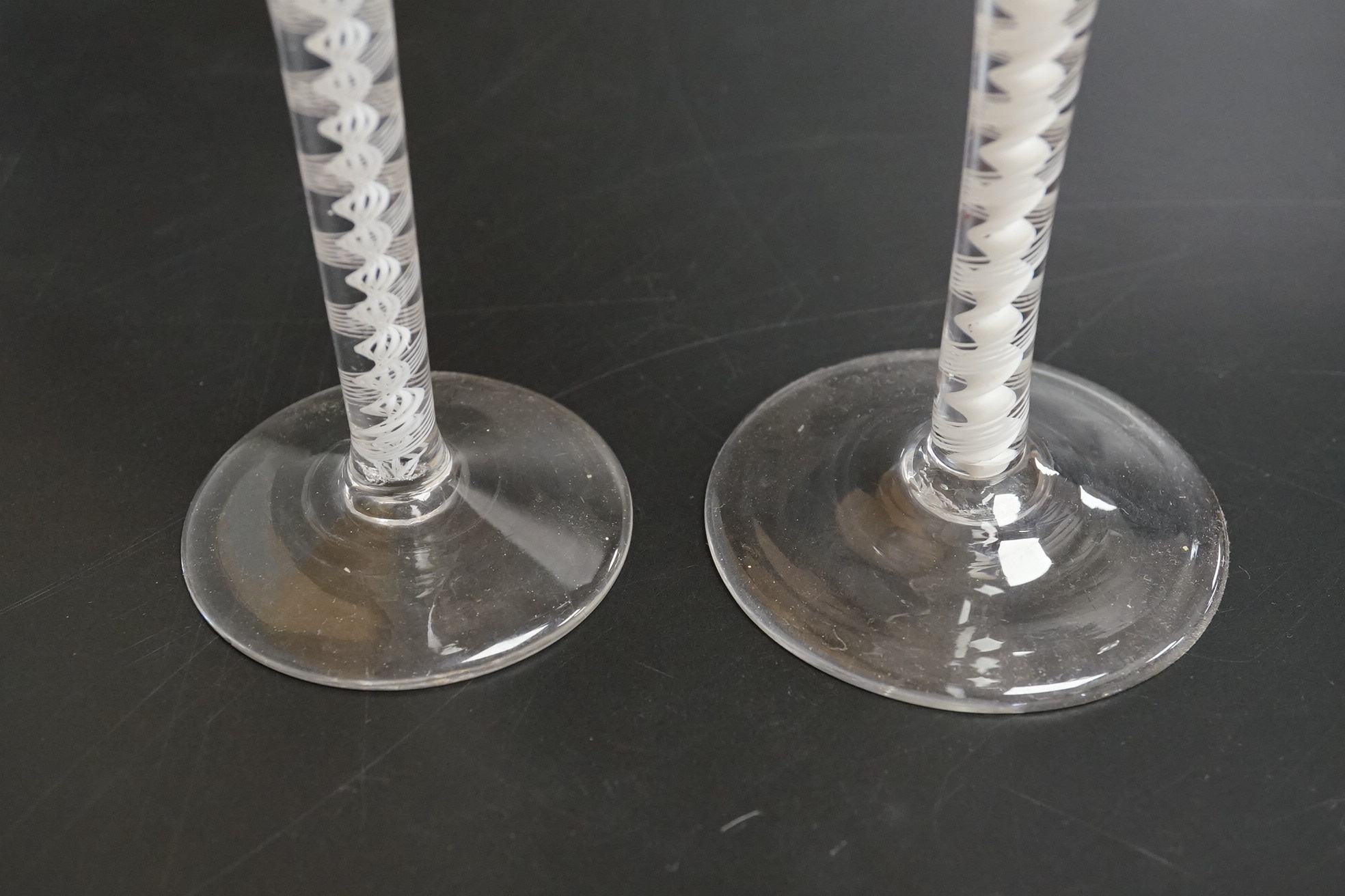 Two DSOT stem wine glasses, c.1760, with funnel shaped bowls, tallest 16.5cm high
